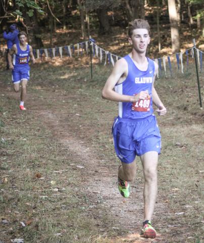 Gladwin’s Elijah Christensen rolls to the finish line first at the Cedar Bend Invitational Saturday at the Gladwin County Recreation Area.