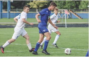 Caleb Palmreuter out dribbles Northern Michigan Christian Academy players.