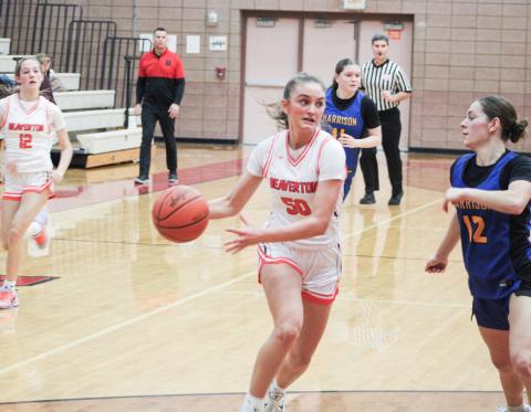 Myah Hubble eyes the basket and the defense while driving the lane during Beaverton’s win over Harrison.