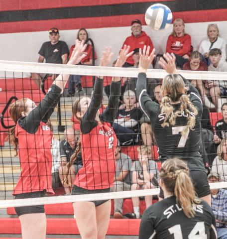 A St. Louis hitter tries to tip the ball out of the reach of the Beaverton blockers Ava Nickel and Bryar Pollard during the Beavers victory last Wednesday night.