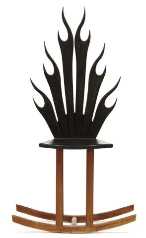 Stylized shapes, light wood, bold blocks of color and unusual construction are characteristics of modern furniture. This flame rocking chair shows all four. KOVELS.COM