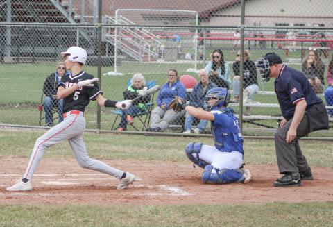 Beaverton’s Jace Mishler hits the ball during the first game of last Tuesday’s doubleheader split with visiting rival Gladwin.