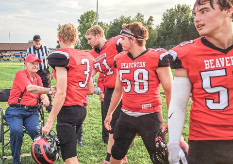Legendary Beaverton football coach Dick Van Wieren greets members of the 2023 team prior to the first game of the season. Van Wieren passed away last week at age 87. RUSTY GOVITZ, BEAVERTON SCHOOLS