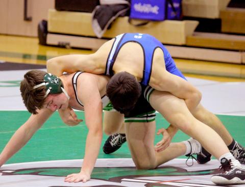 Gladwin looks to wrap up his Clare opponent for the win.