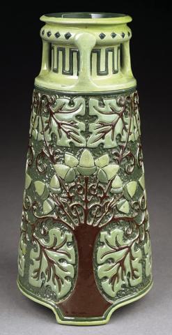 Rhead, Roseville and Della Robbia are three of the most important names in American art pottery. All of them apply to this vase. KOVELS.COM