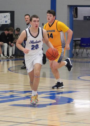 Gladwin’s Brody Verellen races into the front court during last Wednesday night’s victory over Shepherd.