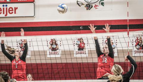 Braylin Orton and Trinity Danielak defend the net during a recent match. The Beavers snapped a three-game losing streak with a win last Wednesday.