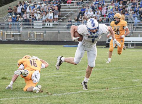 Trace Corlew breaks a tackle during Gladwin’s first meeting with Ogemaw Heights this season. Corlew had a touchdown and a two-point conversion Saturday in a first-round playoff victory at Kingsford.