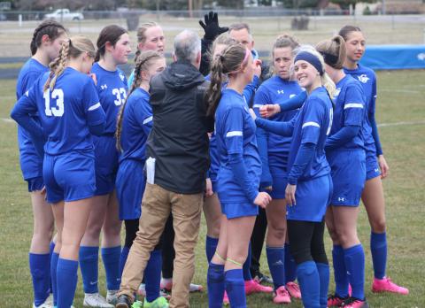 Gladwin coach Chris Pellerito gives the troops a pregame pep talk Thursday.