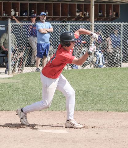 Jackson Fritz of the Gladwin Lightning American Legion Post 171 lays down a bunt during a first-inning rally that led to a 10-0 victory Saturday.