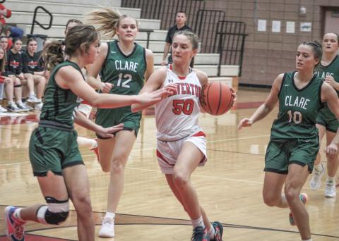 Beaverton’s Myah Hubble fights through the crowd on her way to the basket during last week’s victory over visiting Clare.