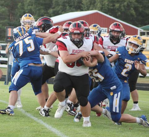 Beaverton big man Leland Love barrels through the line for a two-point conversion during Friday night’s season-opening victory at Evart.