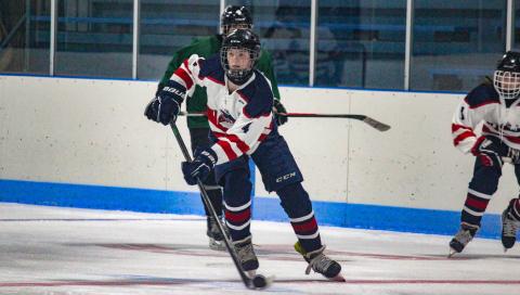 Looking to score, the Gladiators push the puck down the ice.