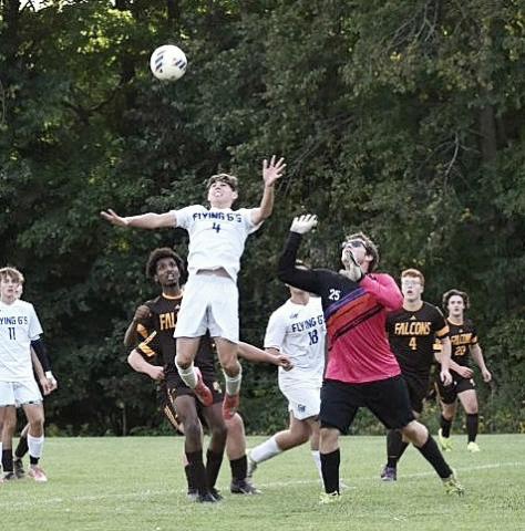Gladwin’s Sam Townsend gets up to head a ball out of danger during last week’s big 1-0 victory at Ogemaw Heights. BETH ORR