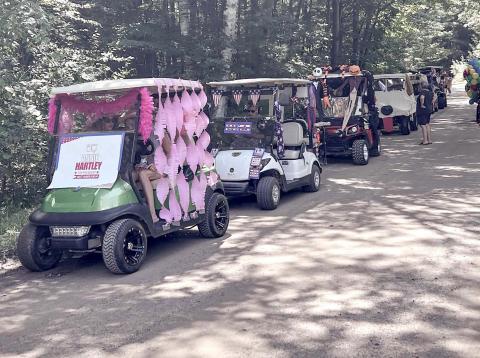 Wiggins Lake holds Golf Cart and Boat Parades