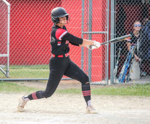 Faith Danielak takes a swing at the ball.
