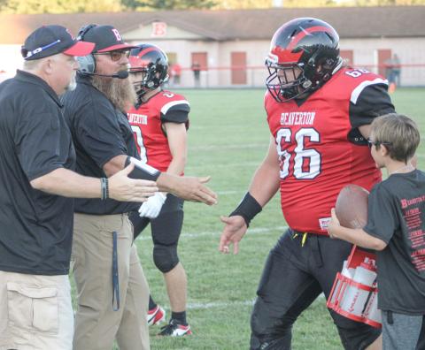 Beaverton’s Leland Love gets a rousing welcome back to the sidelines. The Beavers improved to 2-1 Friday night with a victory over Farwell.