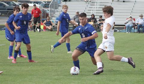 Gladwin’s Barrett Williams cuts off an Ogemaw Heights attacker during last week’s 3-1 loss to the Falcons.