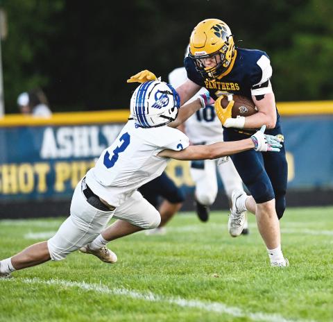 Logan Shell brings down a ball-carrier during Friday night’s victory at Standish in the Jack Pine Conference opener. MINDY STOKOSZYNSKI