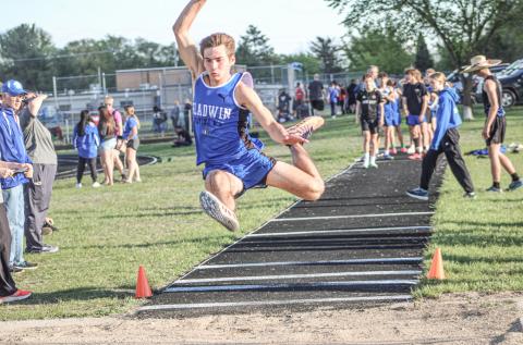 Gladwin’s Drew von Matt soars to a second-place finish in the long jump Friday at the Legends Track Meet.