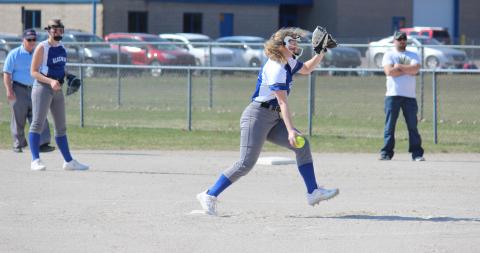 Gladwin pitches the ball to open up the first inning. Inset photo, Gladwin’s shortstop lining up to make the catch.