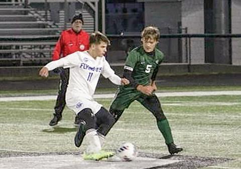 Gladwin’s Andrew Von Matt wards off a Clare defender during the Flying G’s 2-1 double overtime league championship victory.