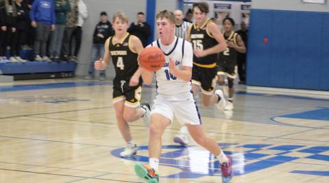 Jacob Pahl runs the floor during Gladwin’s 85-41 victory over Ogemaw Heights last Wednesday night. The sophomore made nine 3-pointers to break the school’s single-game record and finished with a total of 29 points.