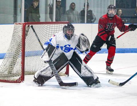 Sophomore goalie Preston Willert guards the cage for his first varsity victory during the Gladwin hockey team’s 4-2 victory over Jackson United Friday night.