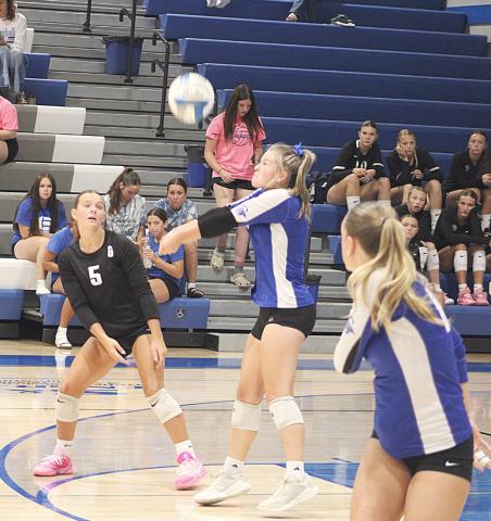 Gladwin’s Angelica Corlew passes a serve during last Wednesday night’s season-opening victory over Tawas.