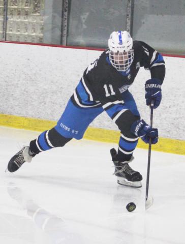 Gladwin’s Clay Newman gets ready to back-hand a pass in front of the net during Saturday’s loss to Midland Dow. SCOTT SALOWICH SPORTS@THEGLADWIN COUNTYRECORD.COM