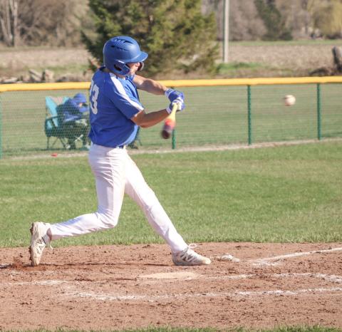 Gladwin’s Logan Walters takes a cut at a pitch during the season-opening doubleheader Friday at Pinconning.