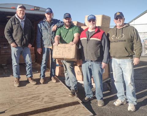 The Gladwin Christian Men’s Club Picking up 2024 boot order at Family Farm &amp; Home. Inset photo, boots delivered to Beaverton.