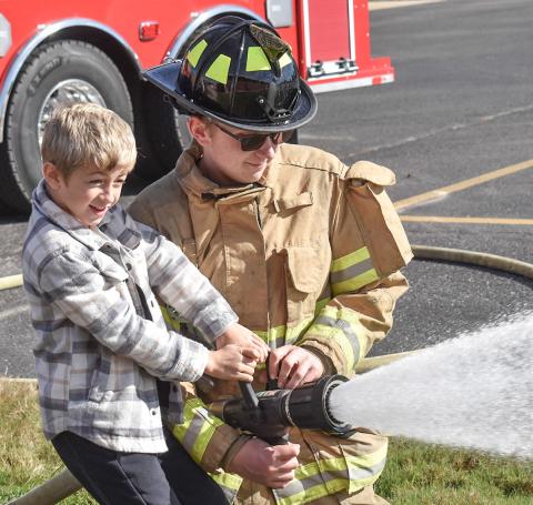 Kids at Beaverton Elementary got to spray a fire hose when Beaverton Fire Department’s Chief Phil Andrist and his partner Case Dunn visited.