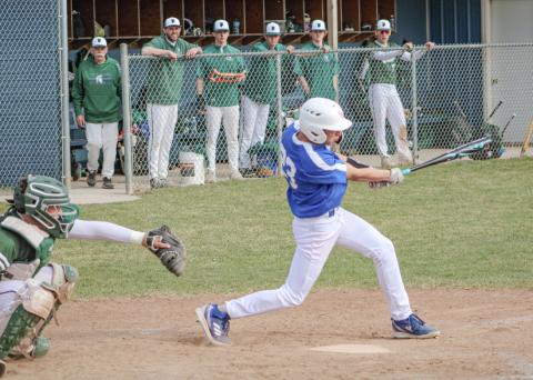 Gladwin’s Logan Walters takes a cut during the first game of Thursday’s doubleheader split with visiting Pinconning.