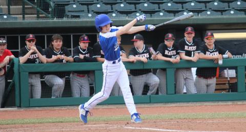 Gladwin takes a swing at the ball.