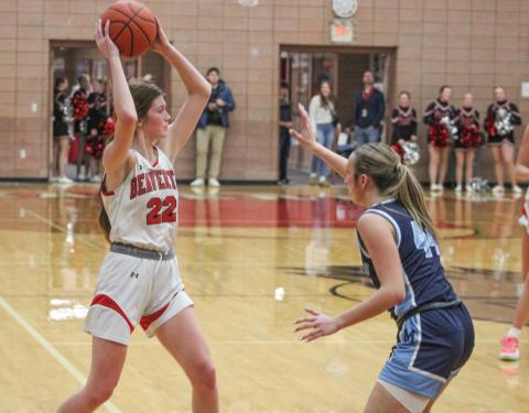 Beaverton’s Bryar Pollard holds the ball high and looks for an open teammate during Friday night’s loss to Jack Pine Conference leader Meridian. The Beavers will visit rival Gladwin Friday.