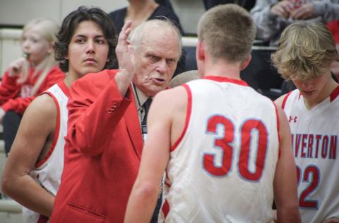 In the middle of the first game of his 50th season at the helm of the Beaverton boys’ basketball team, Beavers coach Roy Johnston makes a point to senior point guard Layk Woodruff. Beaverton beat Coleman 41-25.