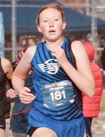 Gladwin’s Alanis Povey races to a spot at the state meet with a personal best time at the Division 2 regional Saturday at Benzie Central.