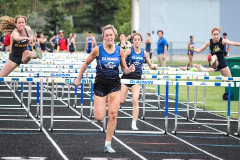 Lizzie Haines sprinting to the finish during the May 12 Legends Meet in Gladwin. Haines qualified for State Finals on Friday night in both the 100 and 300-meter hurdles.