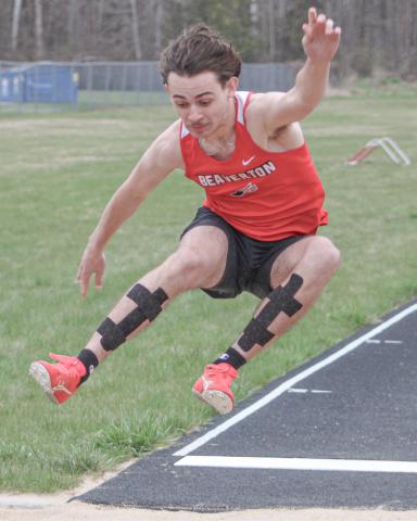 Beaverton’s Chayce Cazabon comes in for a landing in the long jump at last week’s track meet.
