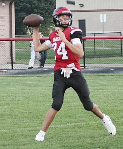 Beaverton quarterback Jace Mishler gets ready to deliver a pass during Thursday night’s loss to visiting Saginaw Michigan Lutheran Seminary.