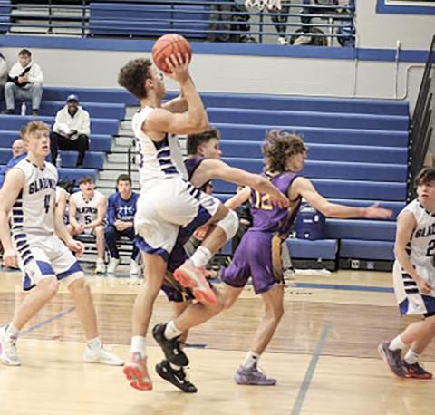 Gladwin’s Jhace Massey takes it to the rim during a game last season. The senior returns to the lineup for the Flying G’s this year.