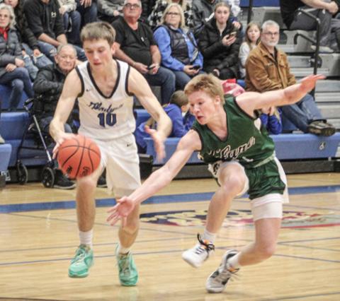 Seth Mead dribbles past a defender during Gladwin’s first meeting with Clare.