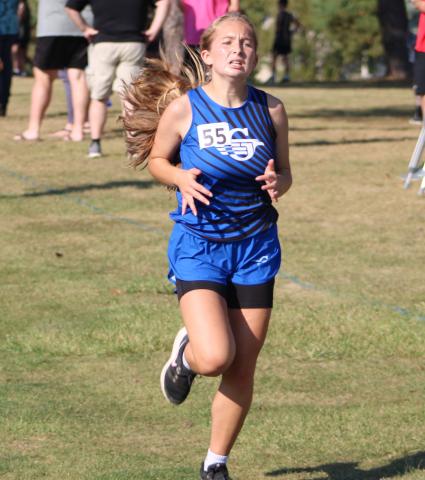 Gladwin’s Michaela O’Callaghan races to the finish line during a recent meet. The Flying G’s will run at the Northern Michigan Meet of Champions Saturday.