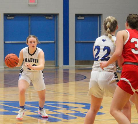 Maelyn Guzman looks to push the ball up court for Gladwin.