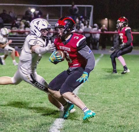 Beaverton’s Carter Kile tries to slip away from a Bullock Creek tackler during Friday night’s loss to the visiting Lancers. PHOTOS BY JESSICA KELLER