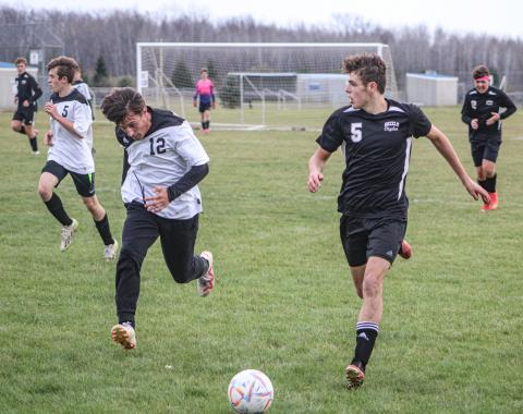 Logan LaBrosse, #5, attempts to get the ball through Bridgeport’s defense.