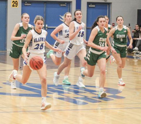 Gladwin’s Breanna Campbell leads the way across the time line on the fast break during Friday night’s 44-36 loss to visiting Clare.