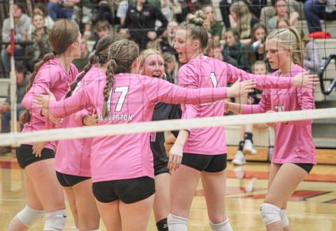 The Beaverton volleyball team celebrates after winning a critical point.