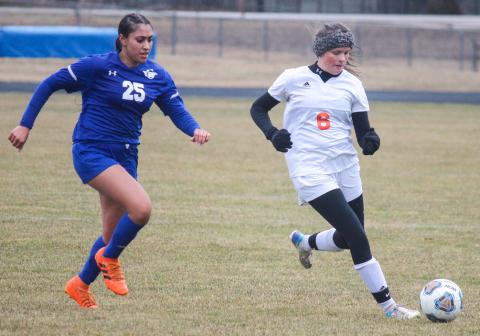 Flying G’s Forward Mahak Kashyap looks to steal the ball from Cheboygan and make a break for the net.
